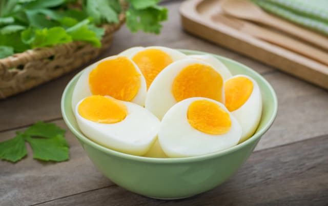 half cut boiled eggs served in bowl