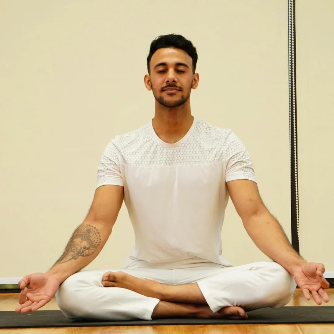 a man doing yoga on yoga mat in the house morning view