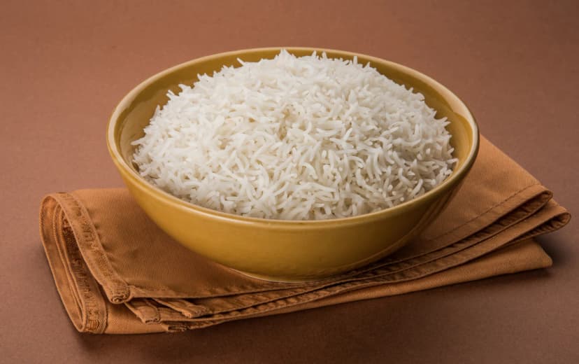 top view white rice in the bowl place in rustic brown clothe