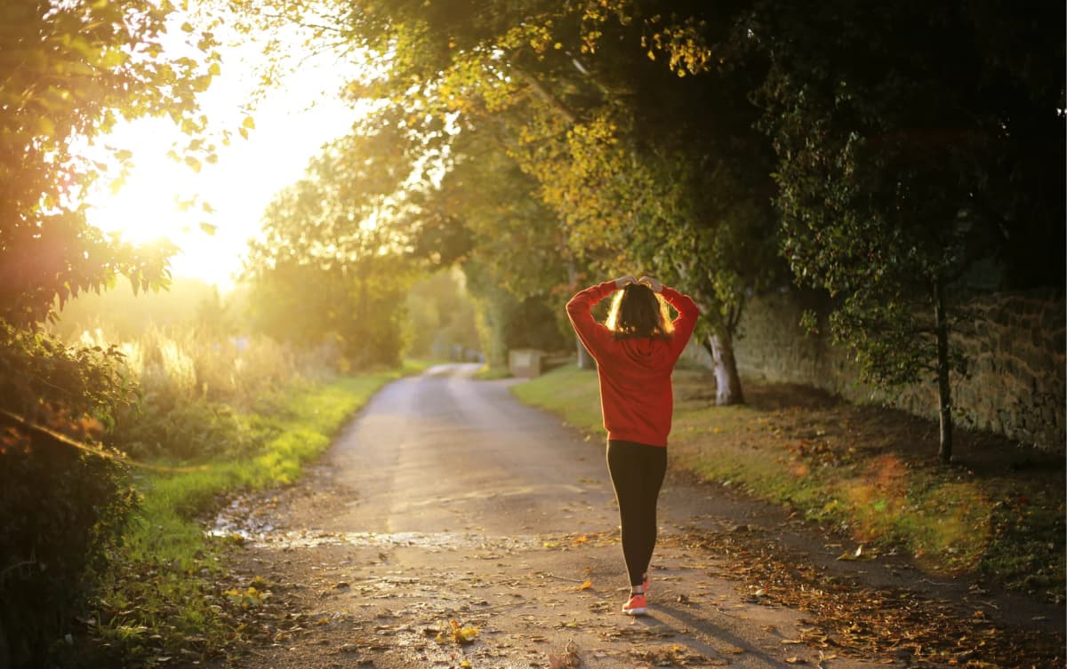 back view of a girl doing morning walk outdoor for fitness and health